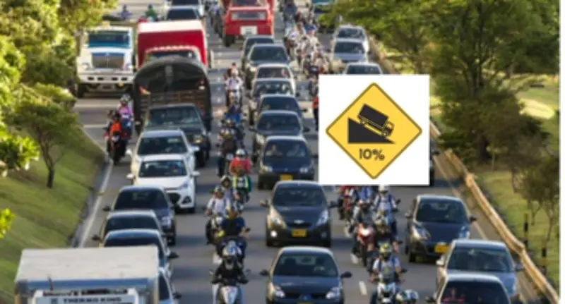 Señal SP-27 en Colombia: Advertencia de Pavimento Resbaladizo que Salva Vidas