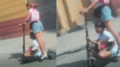 Mujer transporta a dos niñas en patineta eléctrica en Barranquilla: grave riesgo vial