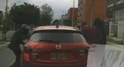 Violento atraco en el norte de Bogotá: delincuentes rompieron vidrios de vehículo en plena vía pública