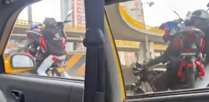 Video viral en Bogotá: moto transportada entre dos personas y las multas que arriesgan
