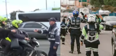 Dos policías inmovilizados en vivo por agente de tránsito en Bogotá